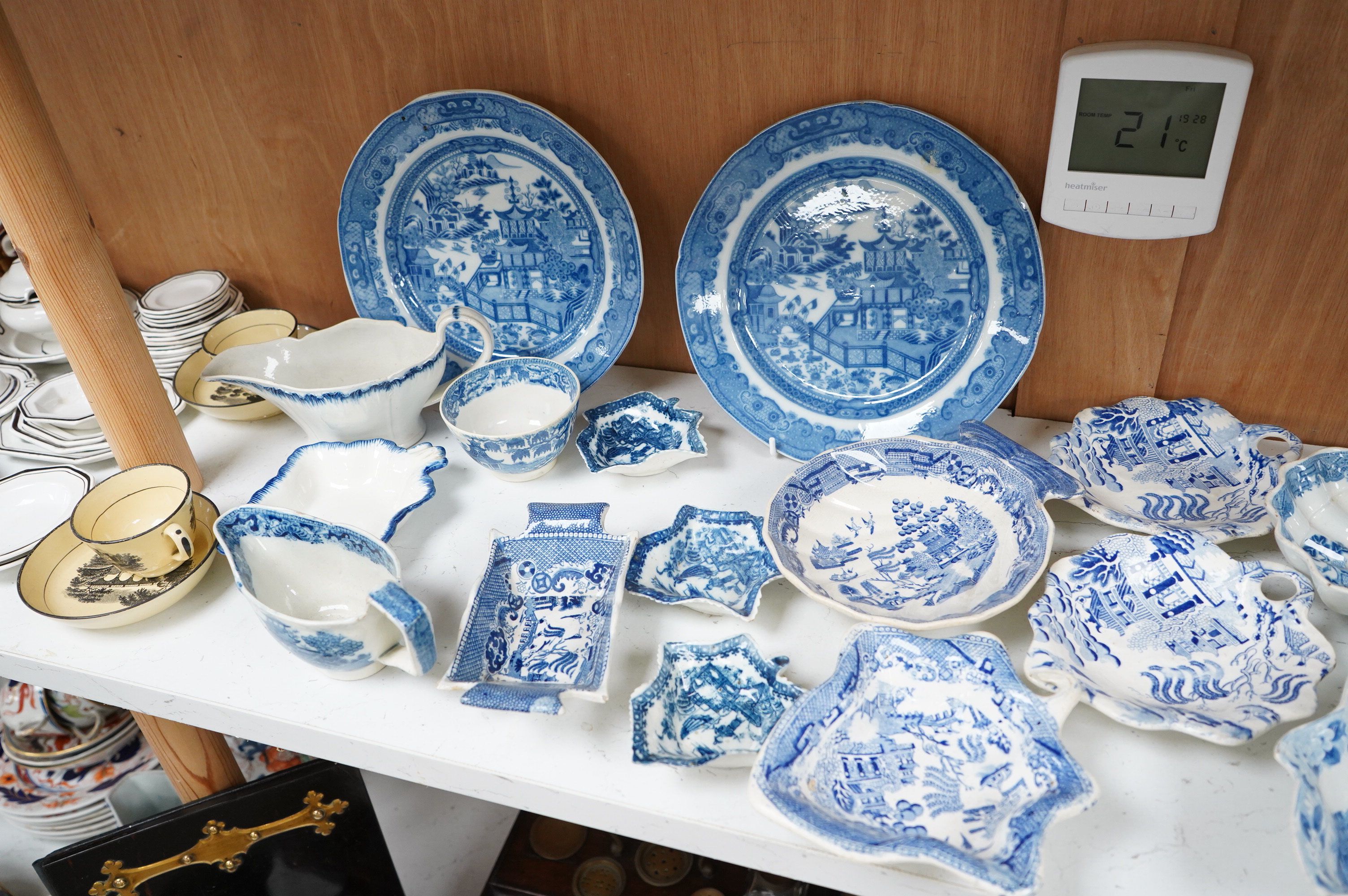 A collection of early 19th century English blue and white pearlware leaf dishes, chestnut baskets, Victorian dolls house dinner service and other pottery